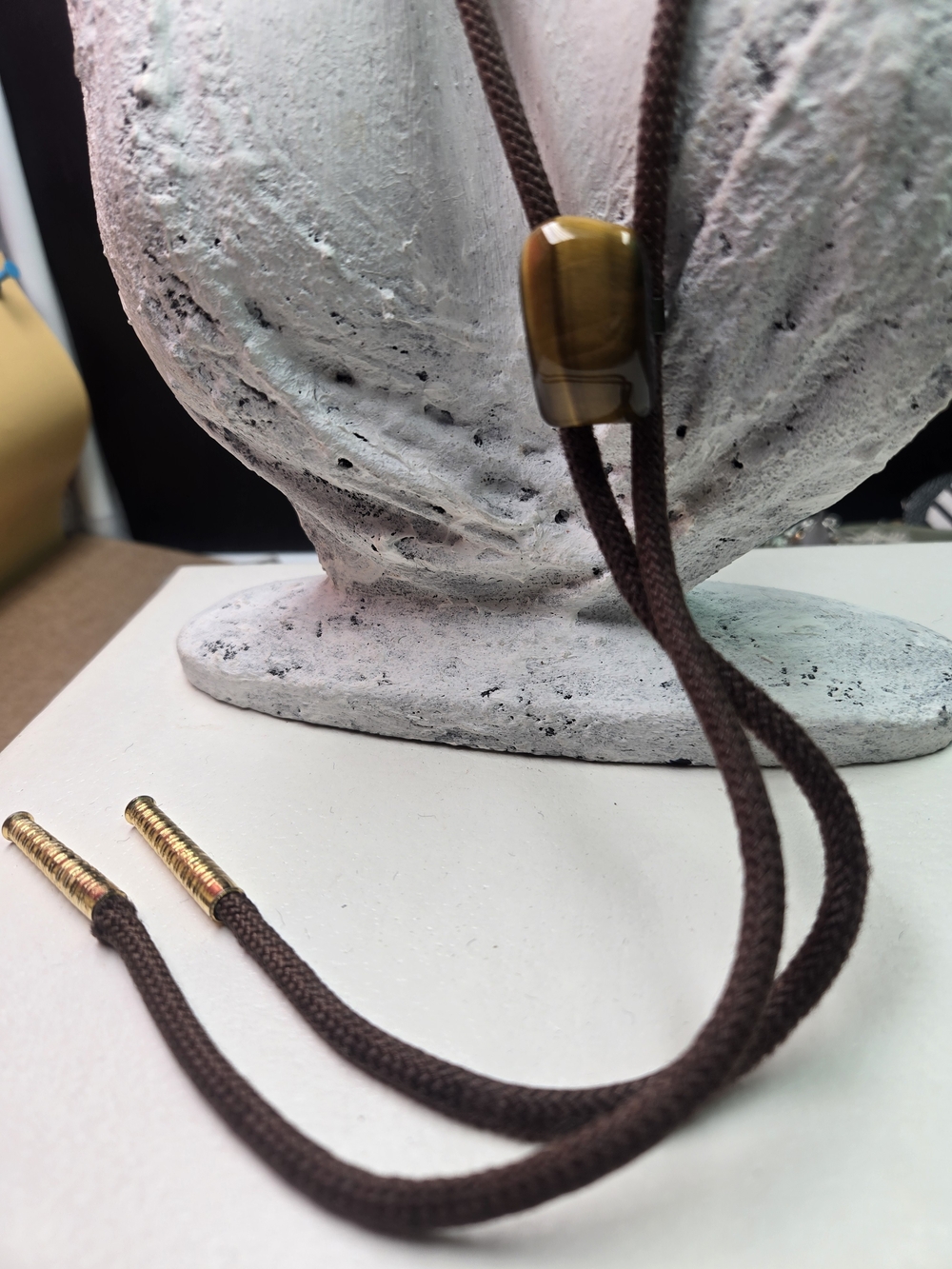 brown and gold Tigers Eye stone Western bolo tie.